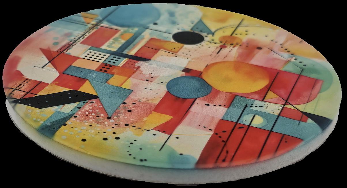 A striking ceramic coaster a colourful abstract geometric design with circles, triangles, squares, adds a bold creative touch to any table.