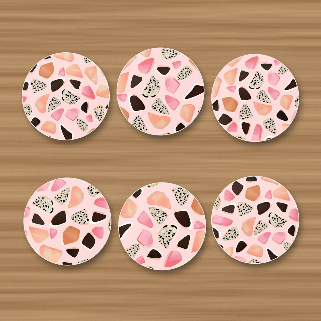 Blush Pink Terrazzo round ceramic coasters, set of 6, glossy finish, on an oak coffee table