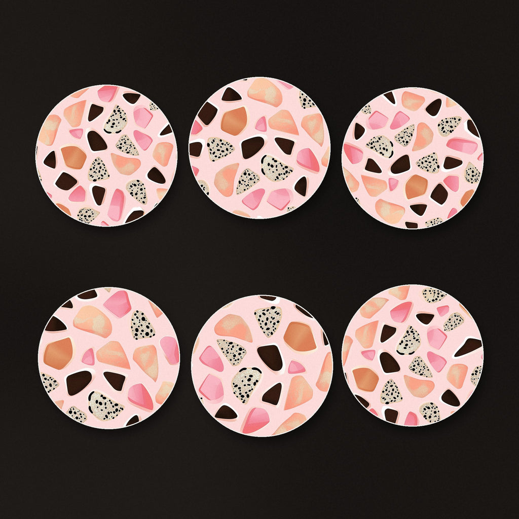 Blush Pink Terrazzo round ceramic coasters, matte finish, on a dark bar counter