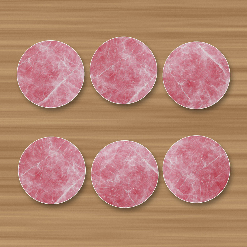 Rose Quartz Pink Marble round ceramic coasters, set of 6, glossy finish, on an oak coffee table