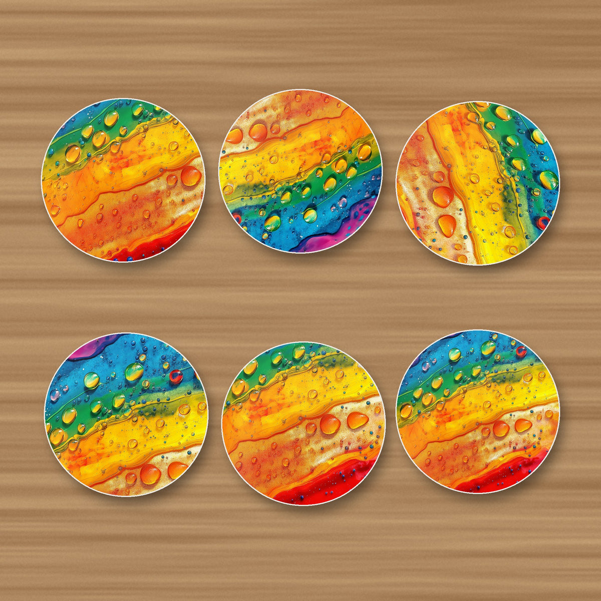 Rainbow Paint Pour round ceramic coasters, set of 6, glossy finish, on an oak coffee table