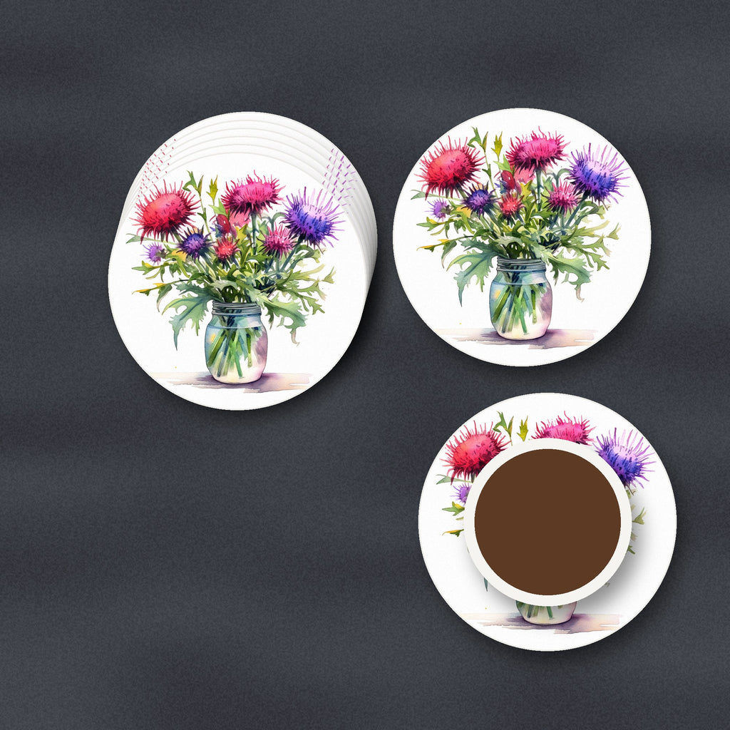 Thistle & Wildflower Jar ceramic coasters, matte finish, stacked on a slate kitchen worktop