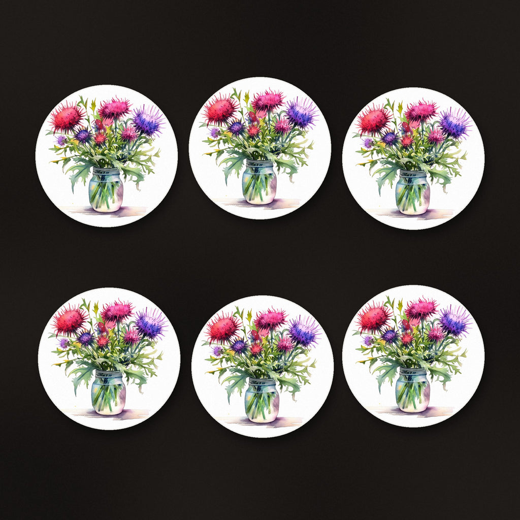 Thistle & Wildflower Jar round ceramic coasters, matte finish, on a dark bar counter