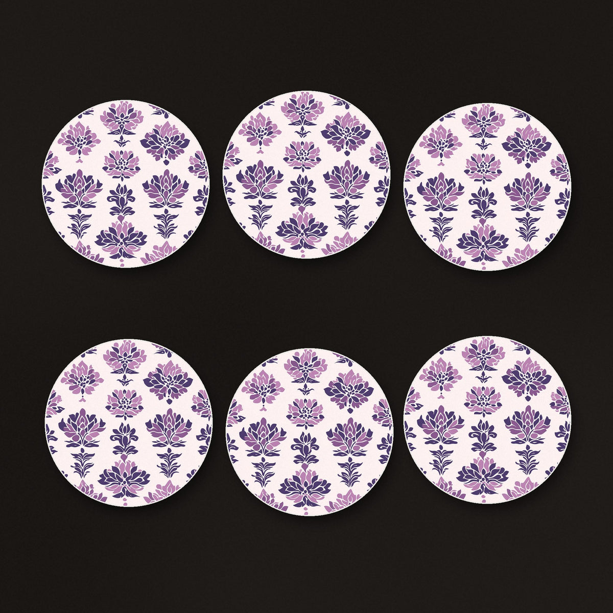 Lilac Damask Pattern round ceramic coasters, matte finish, on a dark bar counter
