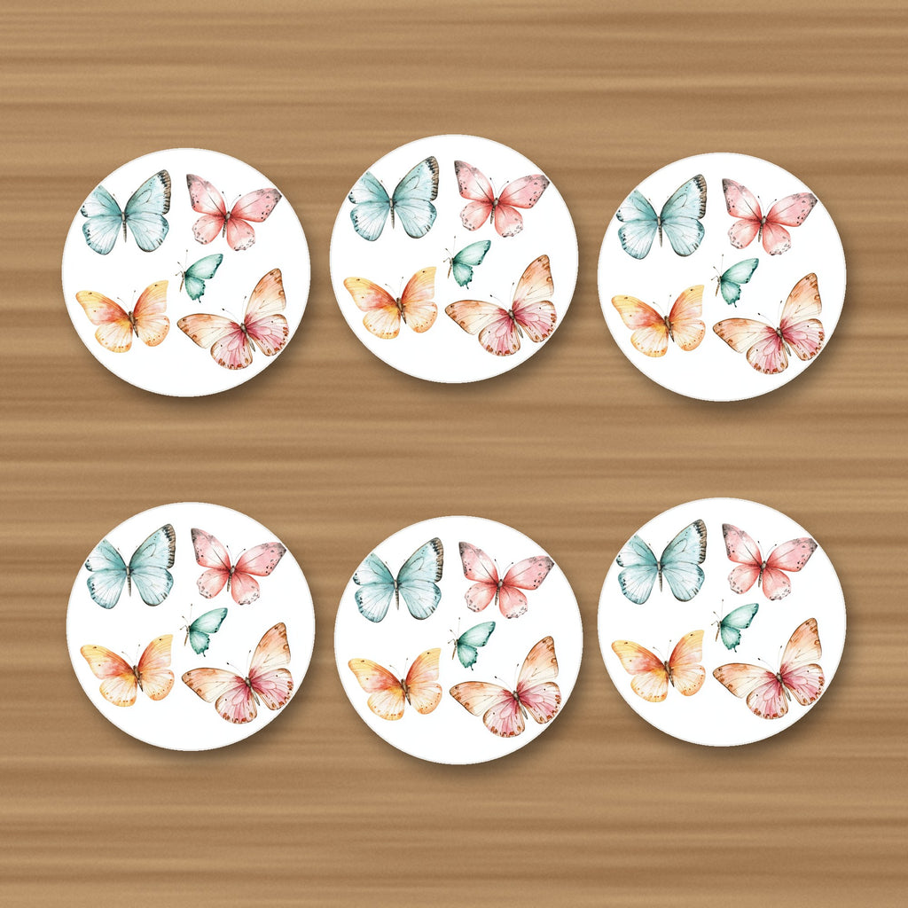 Pastel Butterflies round ceramic coasters, set of 6, glossy finish, on an oak coffee table