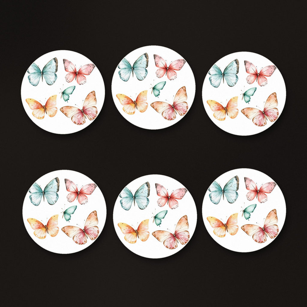 Pastel Butterflies round ceramic coasters, matte finish, on a dark bar counter