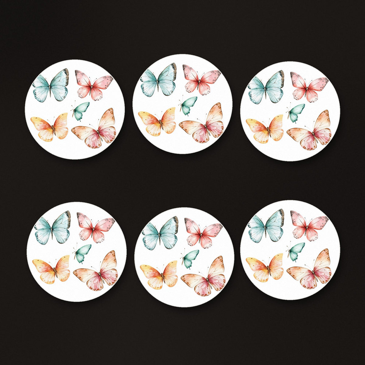 Pastel Butterflies round ceramic coasters, matte finish, on a dark bar counter