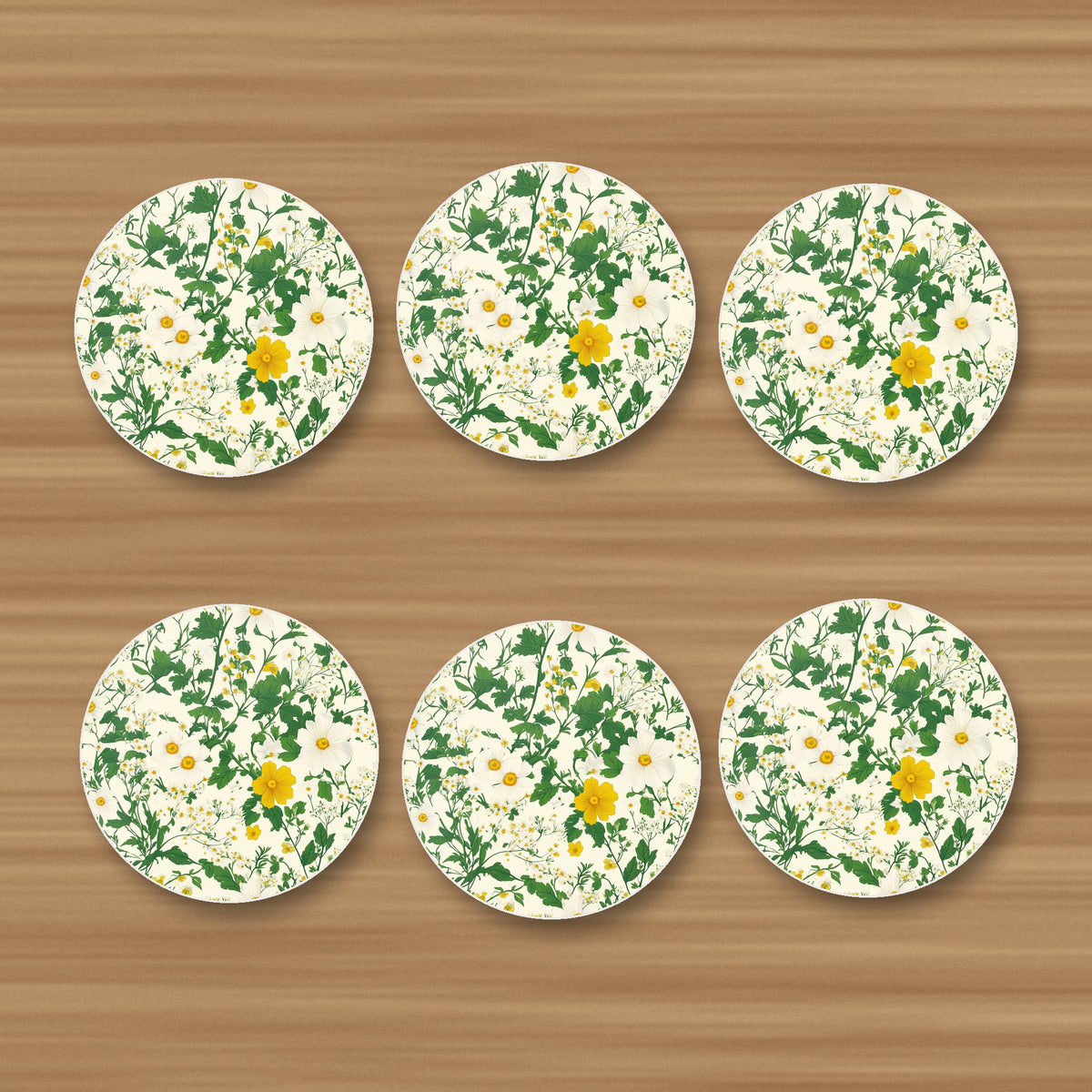 Ditsy Daisy Floral round ceramic coasters, set of 6, glossy finish, on an oak coffee table
