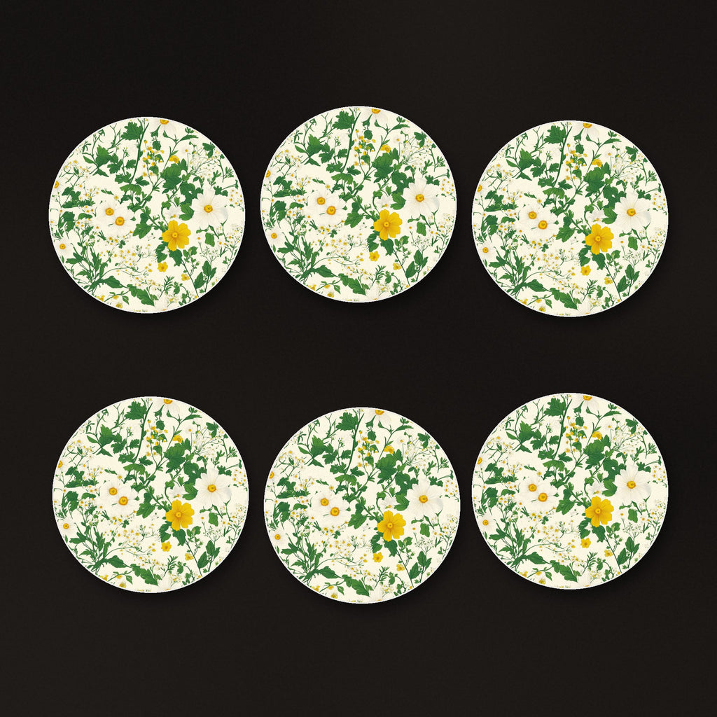 Ditsy Daisy Floral round ceramic coasters, matte finish, on a dark bar counter