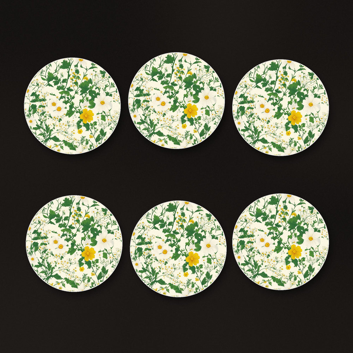 Ditsy Daisy Floral round ceramic coasters, matte finish, on a dark bar counter