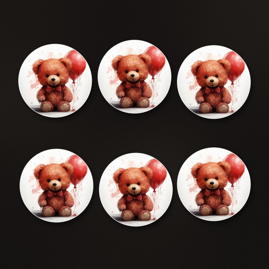 Teddy Bear with Balloon round ceramic coasters, matte finish, on a dark bar counter