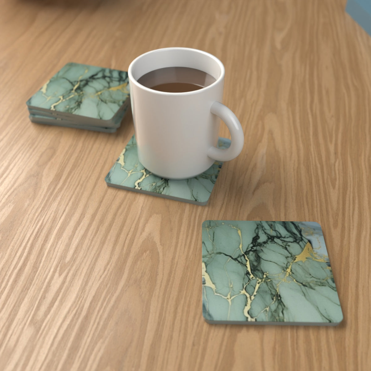 Green Marble square glass coasters on an oak coffee table with a mug – lifestyle mockup 1