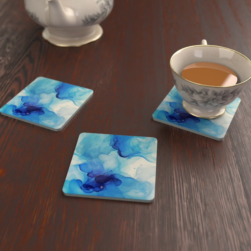 Blue Swirl Marble square glass coasters on a kitchen table with a teacup – lifestyle mockup 2