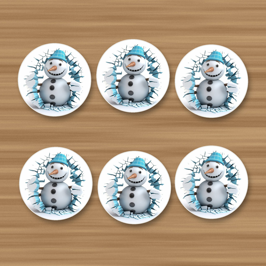 3D Snowman Breaking Through Ice round ceramic coasters, set of 6, on an oak coffee table