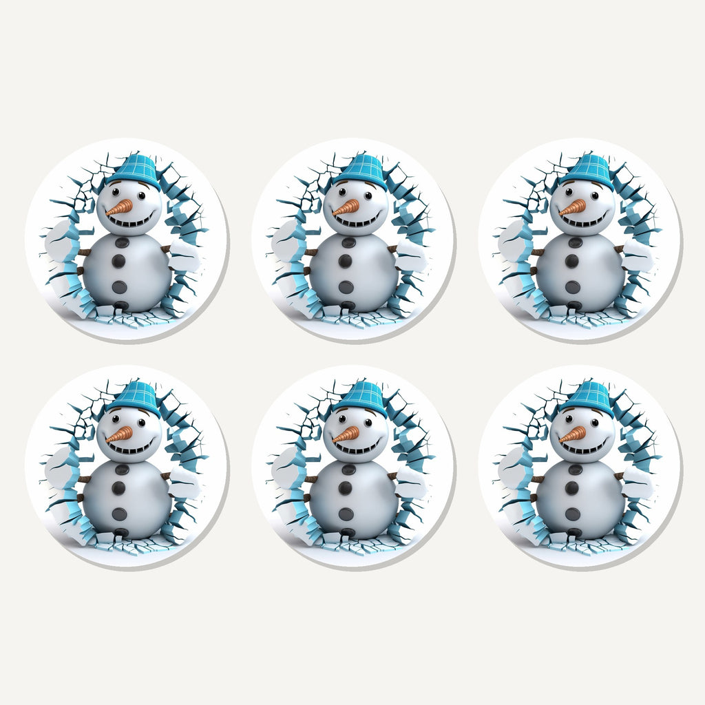Flat lay of the 3d snowman breaking through ice artwork on six round coasters