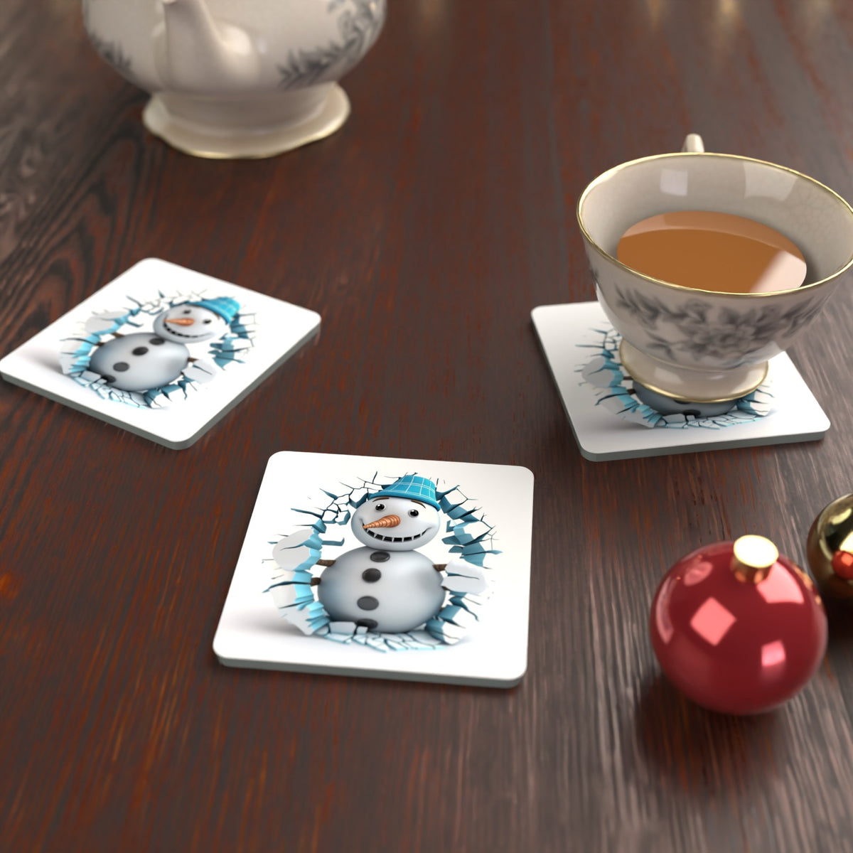3D Snowman Breaking Through Ice Square Glass Coasters – Set of 6 – lifestyle mockup with a teacup