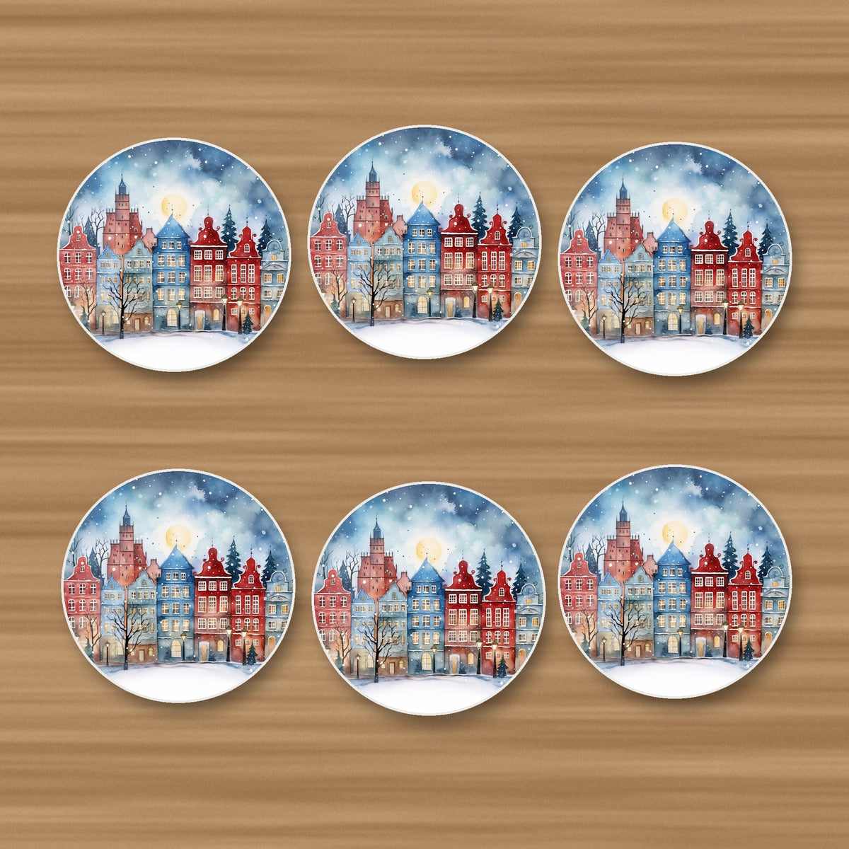 Watercolour Christmas Town round ceramic coasters, set of 6, on an oak coffee table