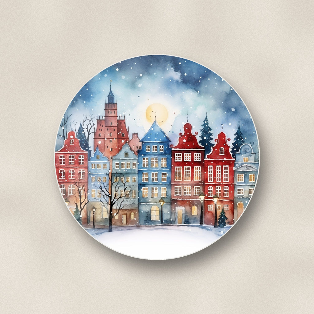 Close-up of one watercolour christmas town round ceramic coaster, flat UV print