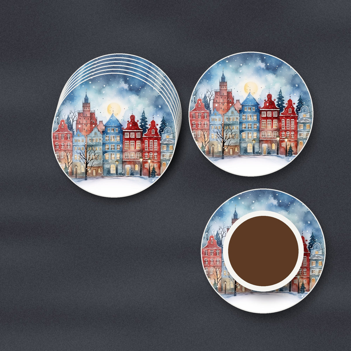 Watercolour Christmas Town round ceramic coasters stacked on a slate kitchen worktop