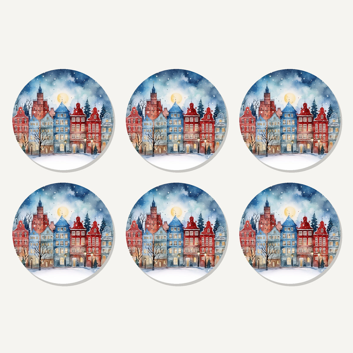 Flat lay of the watercolour christmas town artwork on six round coasters