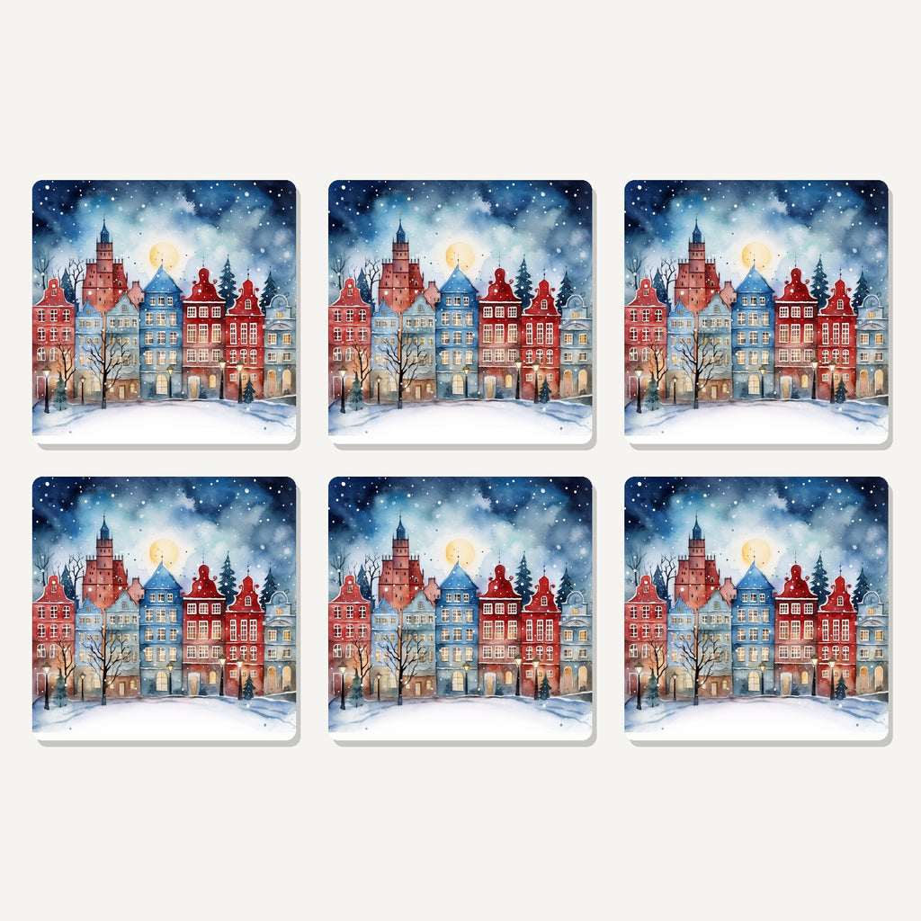 Flat lay of the watercolour christmas town artwork on six square coasters