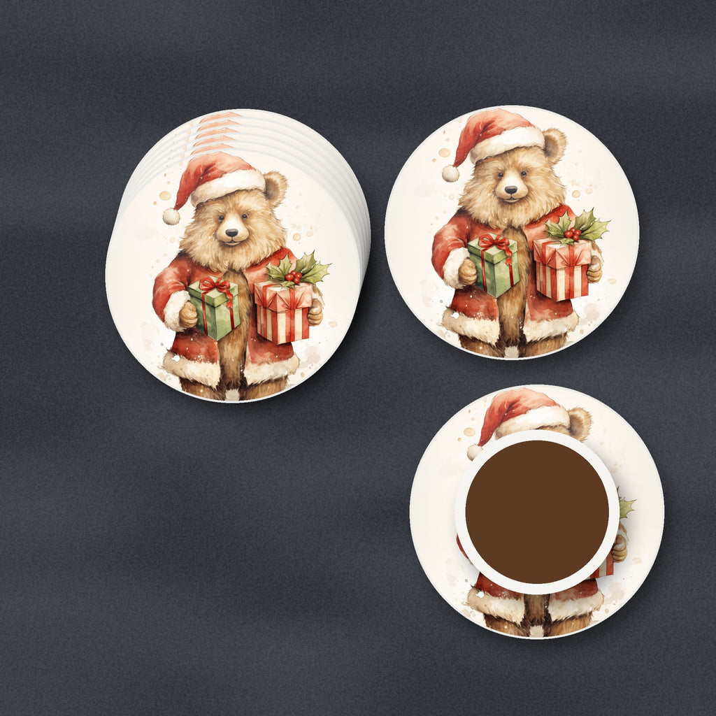 Christmas Teddy with Gifts round ceramic coasters stacked on a slate kitchen worktop