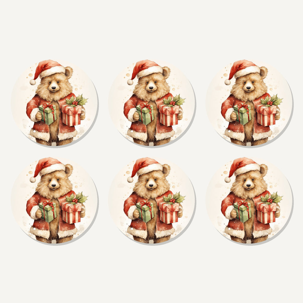 Flat lay of the christmas teddy with gifts artwork on six round coasters