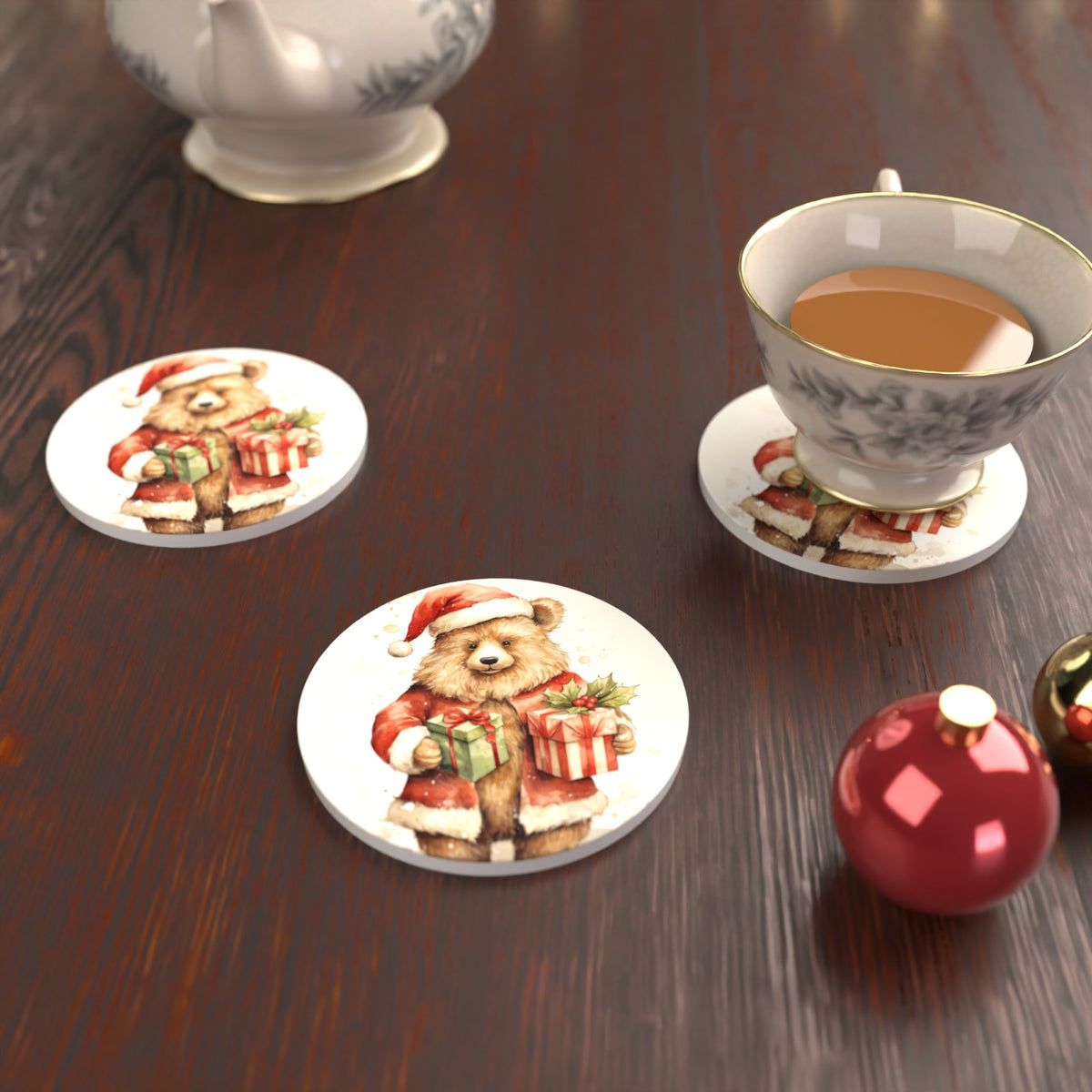 Christmas Teddy with Gifts Round Ceramic Coasters – Set of 6 – lifestyle mockup with a teacup