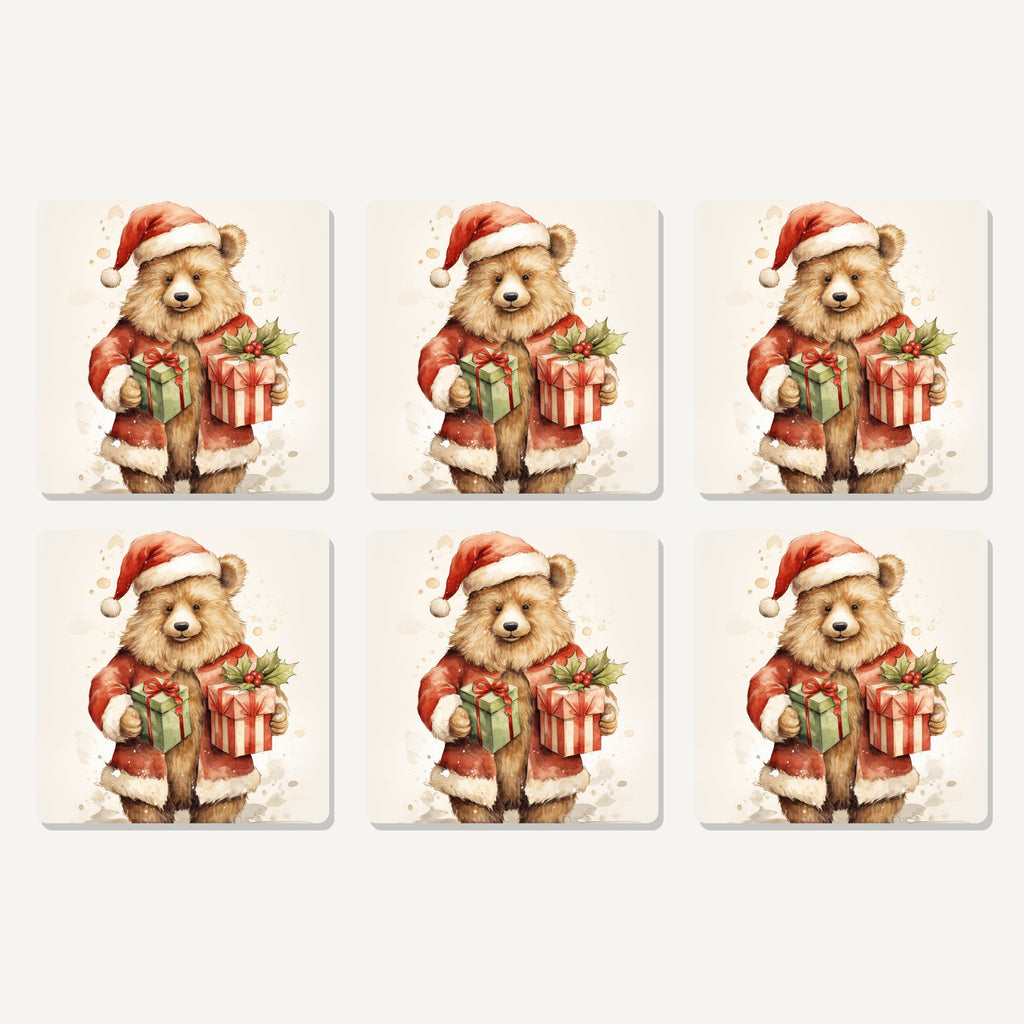 Flat lay of the christmas teddy with gifts artwork on six square coasters