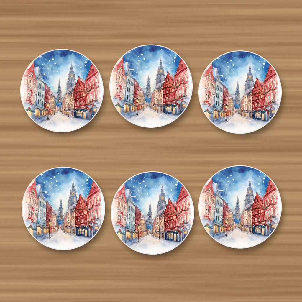 Snowy Christmas Street Watercolour round ceramic coasters, set of 6, on an oak coffee table