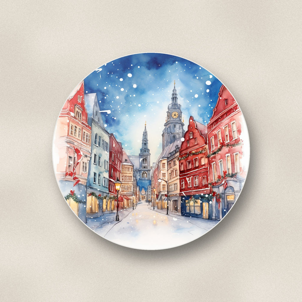 Close-up of one snowy christmas street watercolour round ceramic coaster, flat UV print