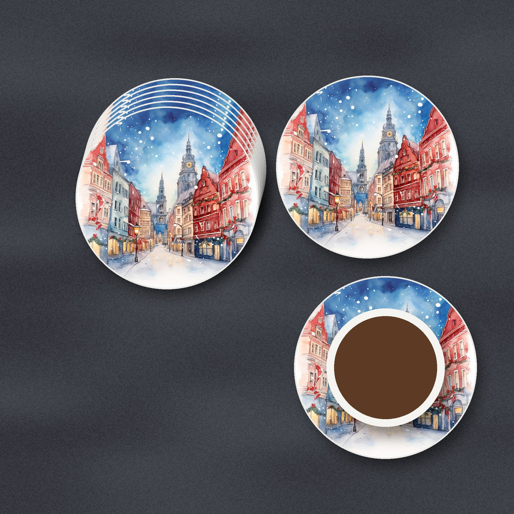 Snowy Christmas Street Watercolour round ceramic coasters stacked on a slate kitchen worktop