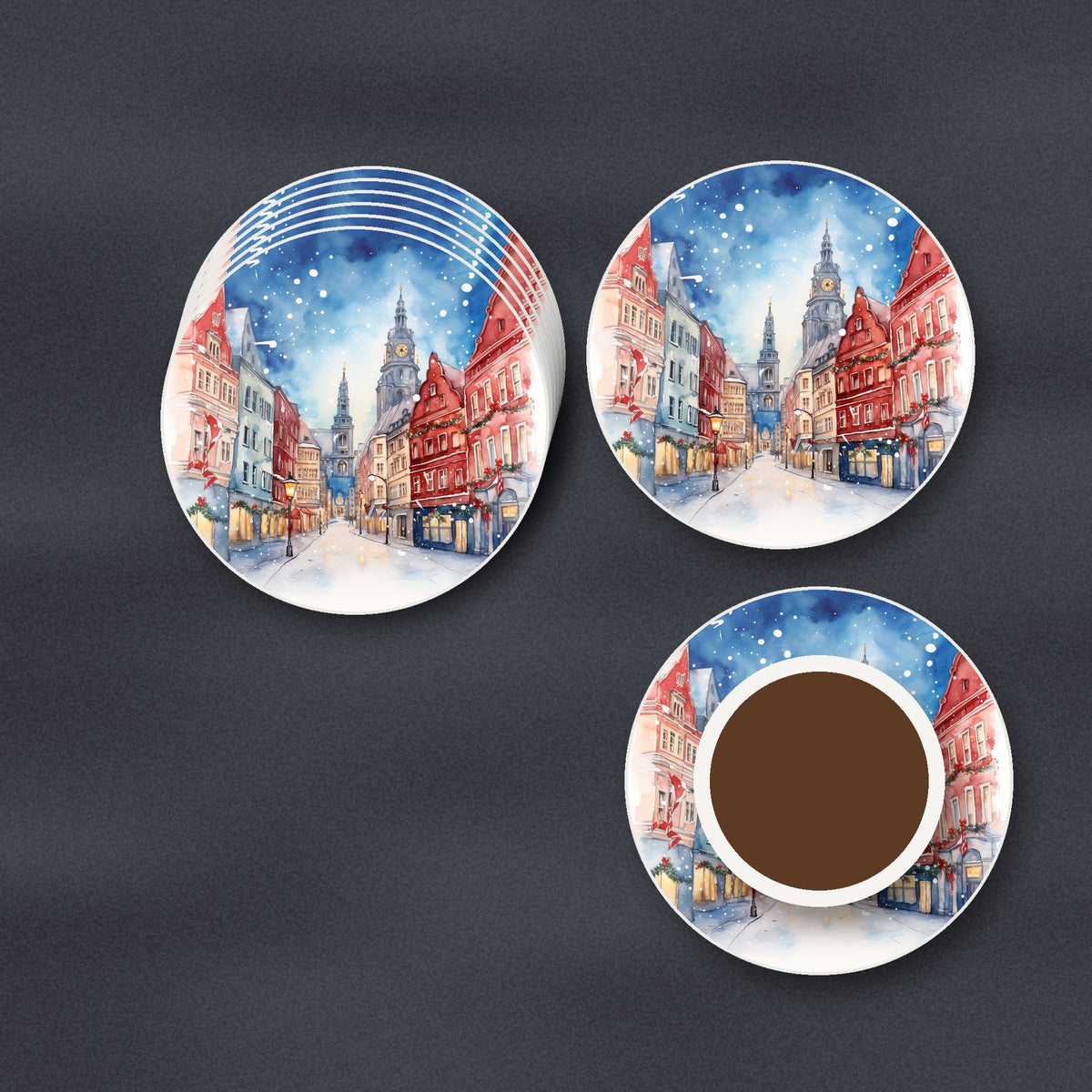 Snowy Christmas Street Watercolour round ceramic coasters stacked on a slate kitchen worktop