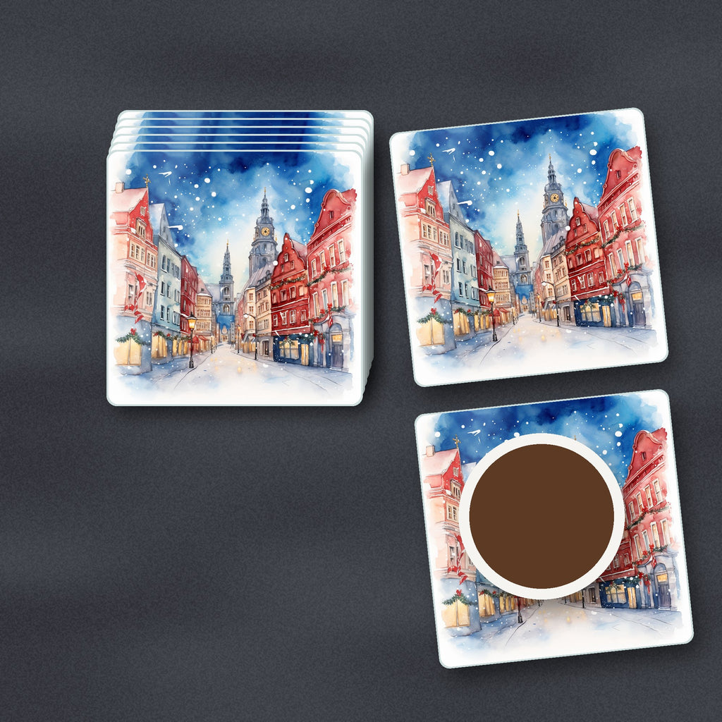 Snowy Christmas Street Watercolour square glass coasters stacked on a slate kitchen worktop