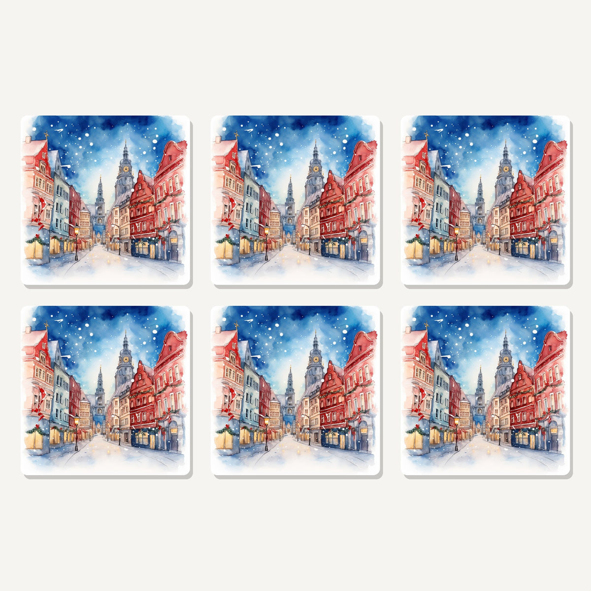 Flat lay of the snowy christmas street watercolour artwork on six square coasters