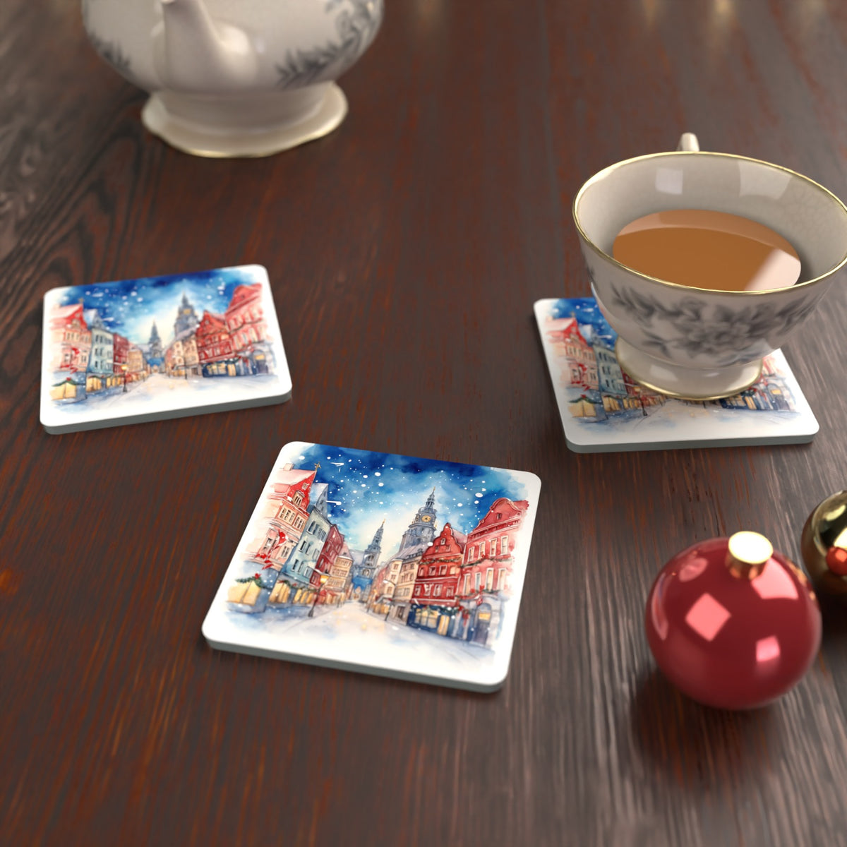 Snowy Christmas Street Watercolour Square Glass Coasters – Set of 6 – lifestyle mockup with a teacup