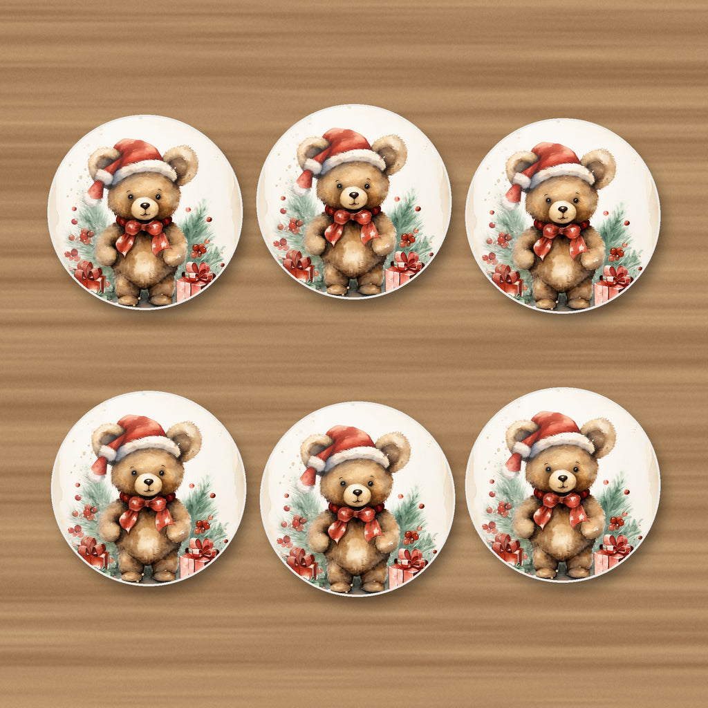 Christmas Teddy in Santa Hat round ceramic coasters, set of 6, on an oak coffee table