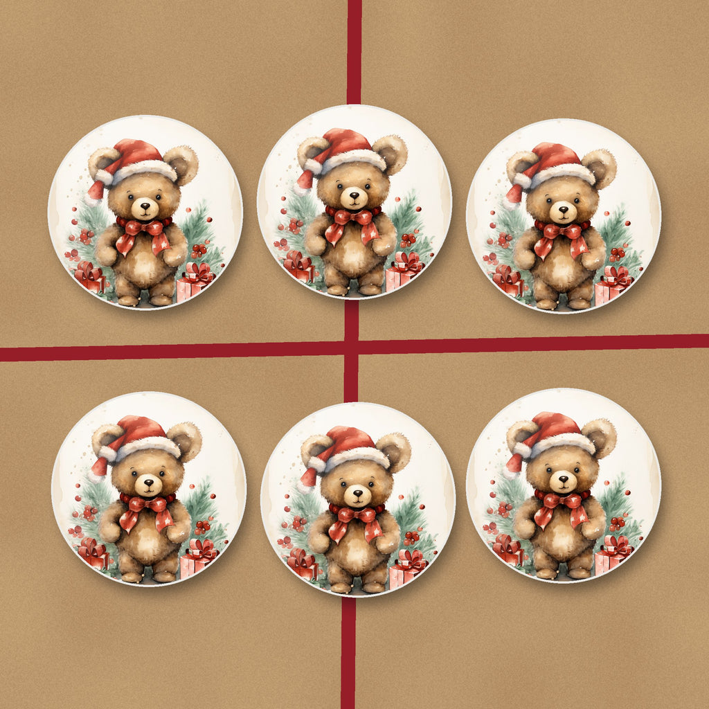 Christmas Teddy in Santa Hat round ceramic coasters on kraft gift wrap