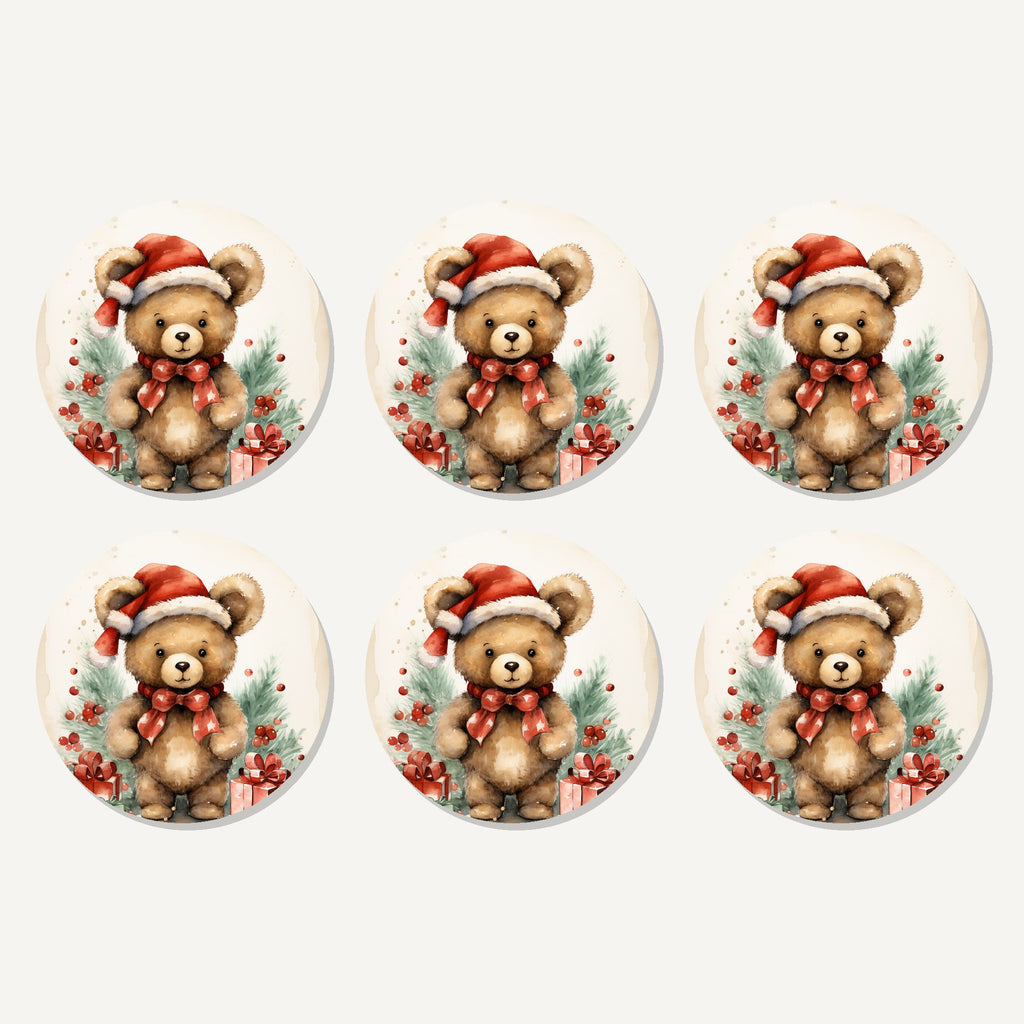 Flat lay of the christmas teddy in santa hat artwork on six round coasters