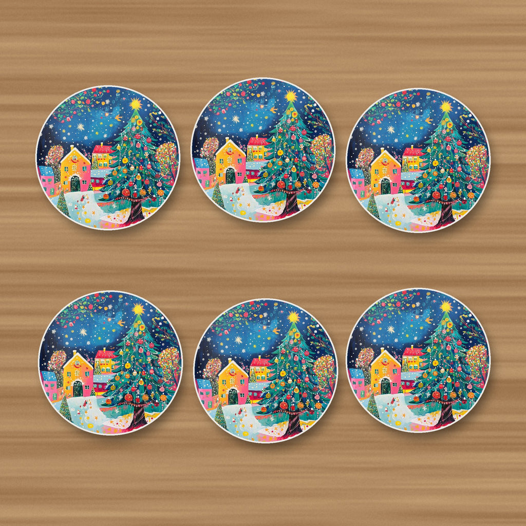 Folk Art Christmas Tree Village round ceramic coasters, set of 6, on an oak coffee table