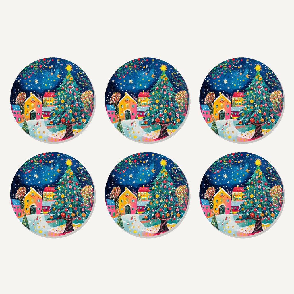 Flat lay of the folk art christmas tree village artwork on six round coasters