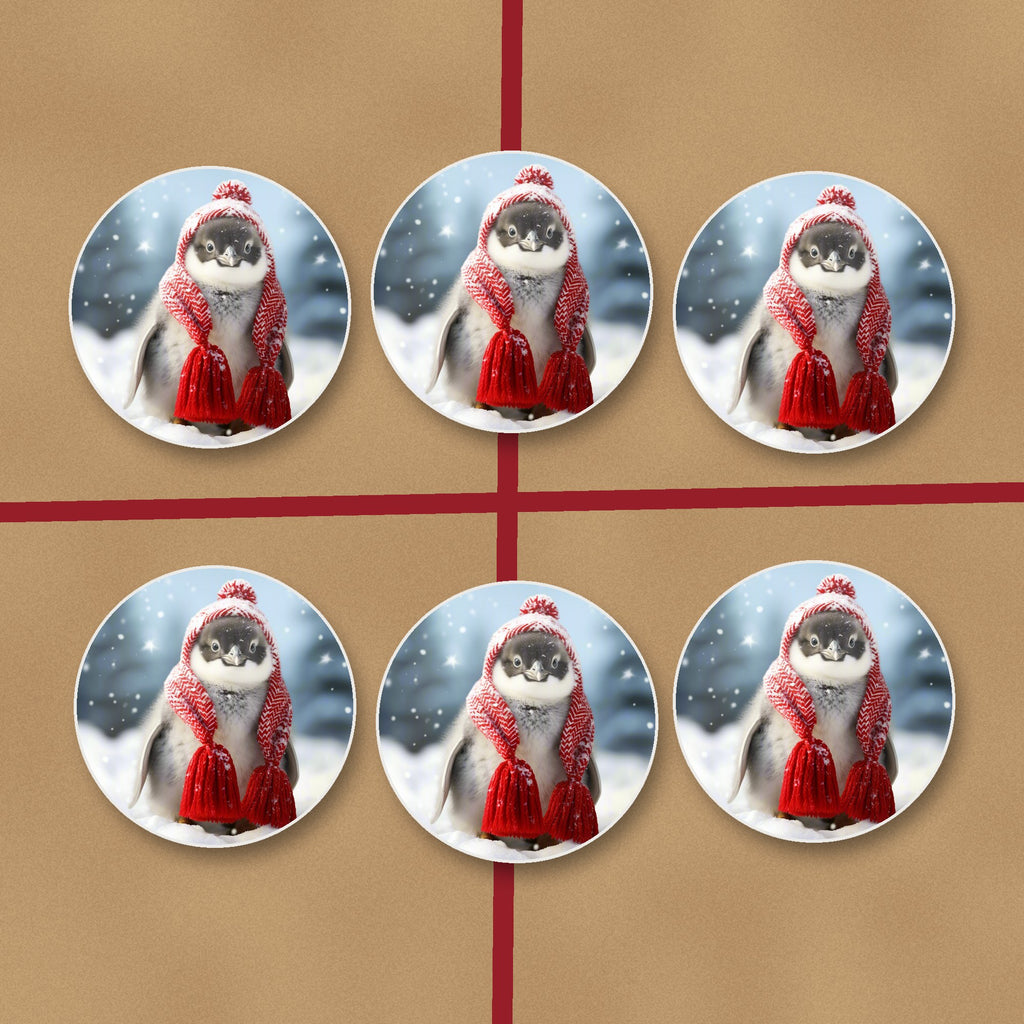 Penguin Chick in Red Knitted Hat round ceramic coasters on kraft gift wrap