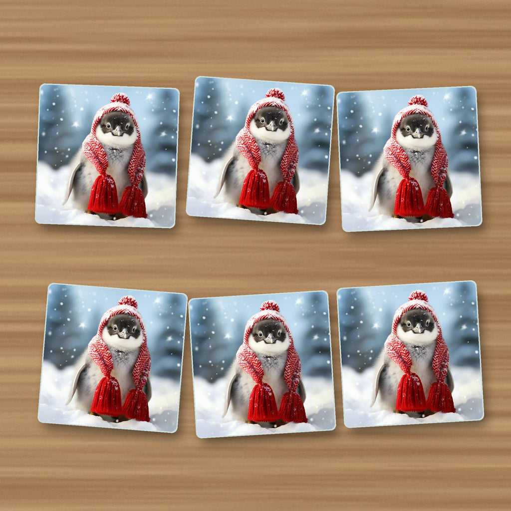 Penguin Chick in Red Knitted Hat square glass coasters, set of 6, on an oak coffee table