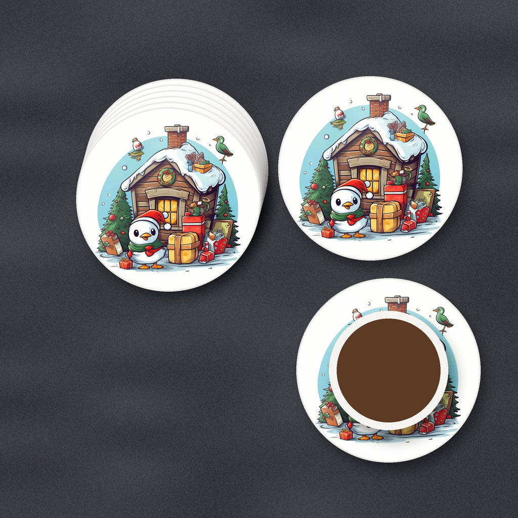 Christmas Cabin with Penguin round ceramic coasters stacked on a slate kitchen worktop