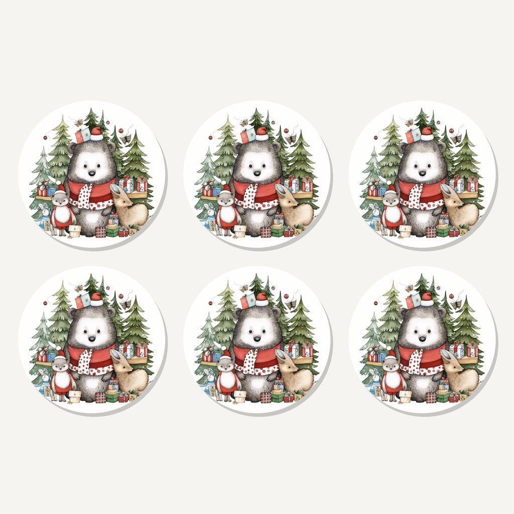 Flat lay of the christmas woodland friends artwork on six round coasters