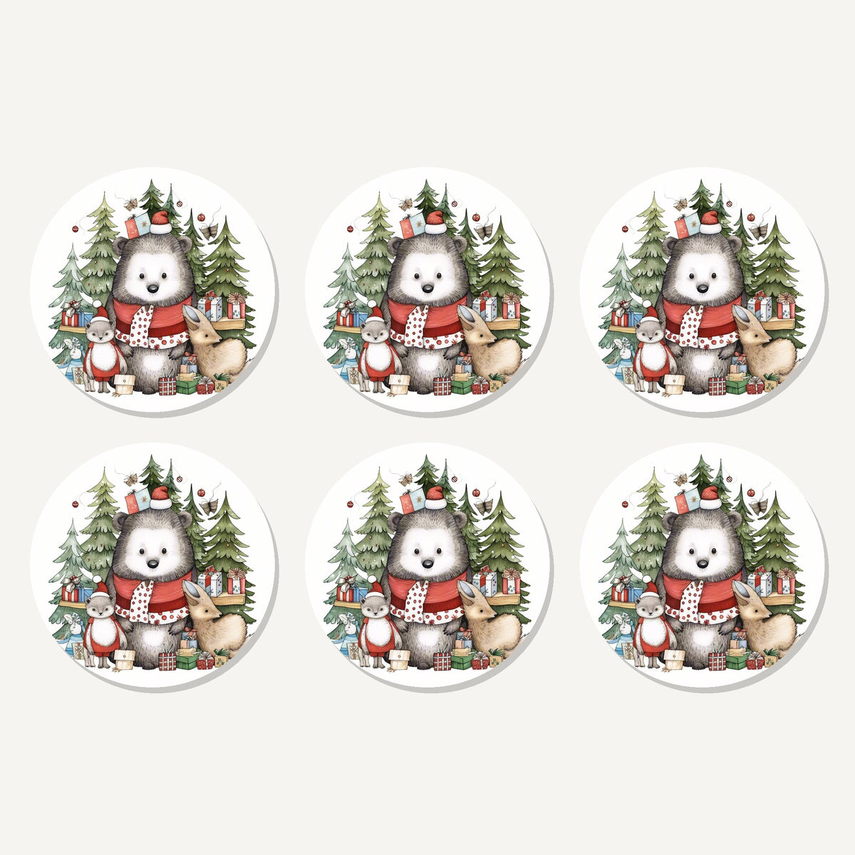 Flat lay of the christmas woodland friends artwork on six round coasters
