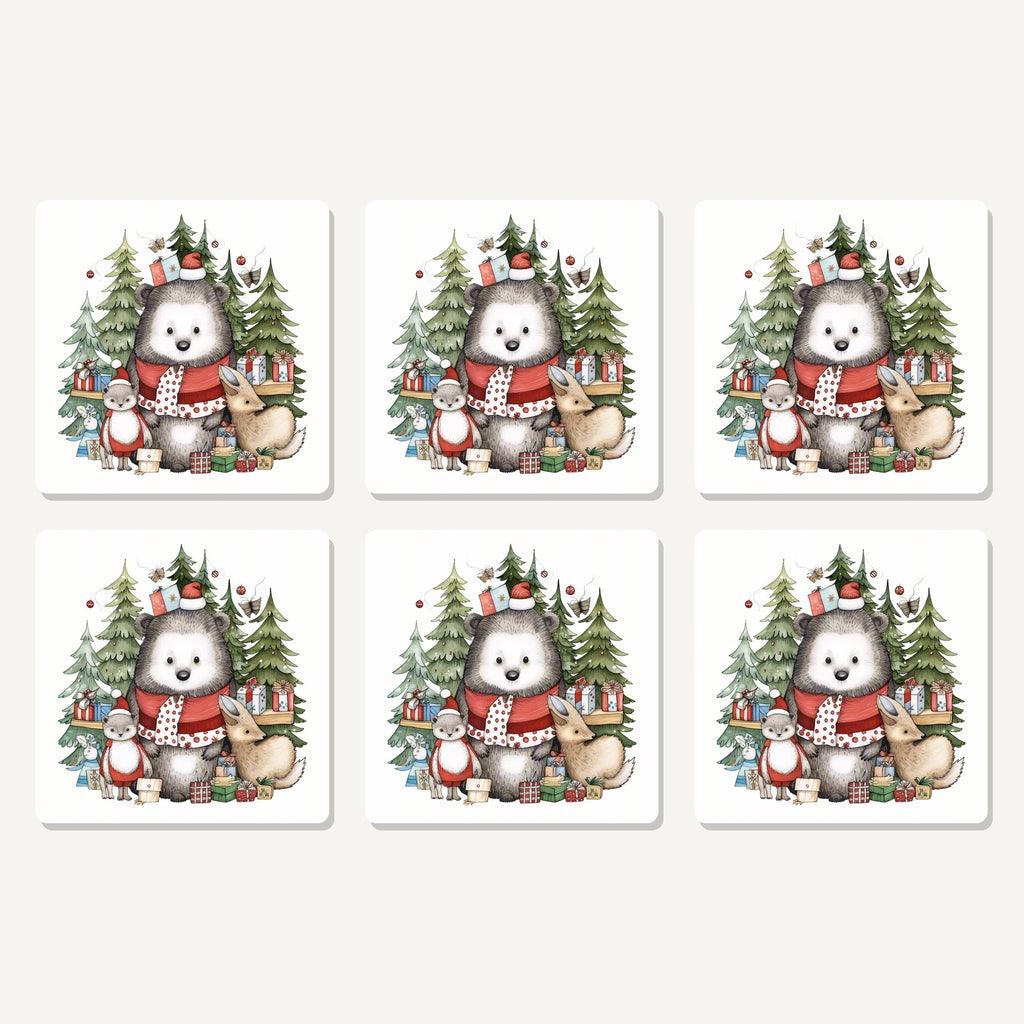 Flat lay of the christmas woodland friends artwork on six square coasters