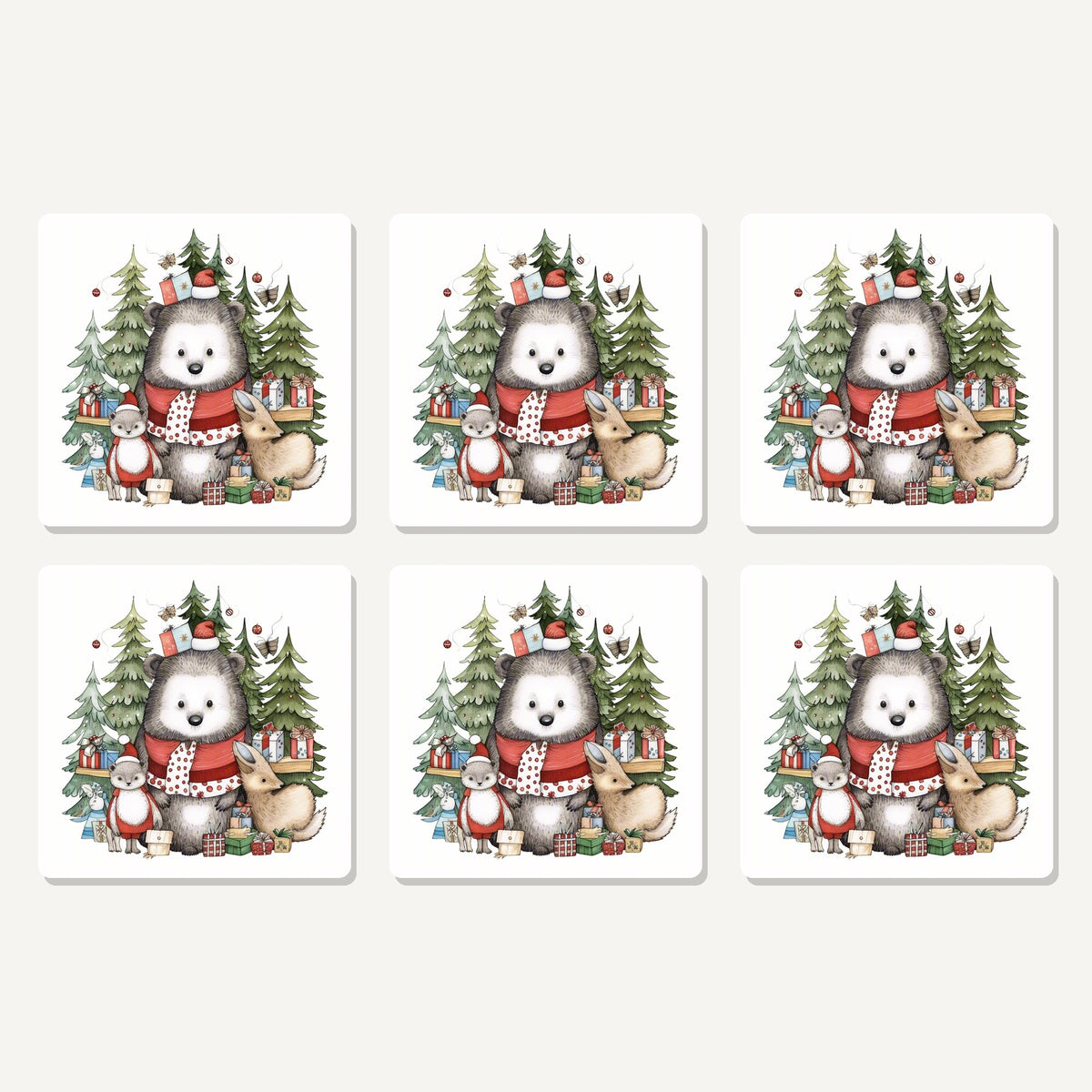 Flat lay of the christmas woodland friends artwork on six square coasters