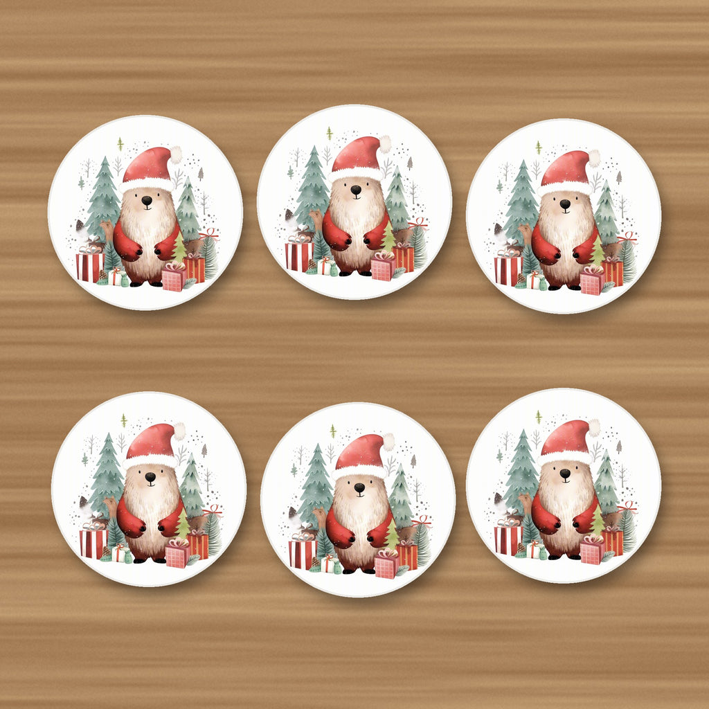 Christmas Bear in Santa Hat round ceramic coasters, set of 6, on an oak coffee table
