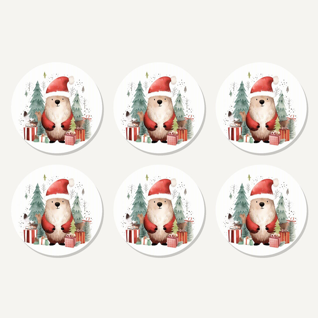 Flat lay of the christmas bear in santa hat artwork on six round coasters
